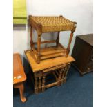 A pine nest of tables and a stool