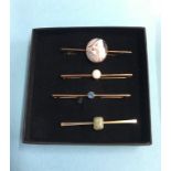 Four 9ct brooches set with opals etc., 10.6g