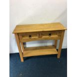A pine two drawer side table