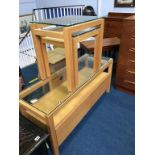 A modern nest of tables and a long two drawer side table, with glass top