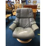 A grey leather swivel chair