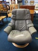 A grey leather swivel chair