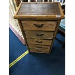 A bamboo narrow chest of five drawers