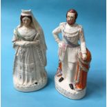 A large pair of Staffordshire figures 'The Prince of Wales' and 'Queen Victoria'