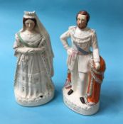 A large pair of Staffordshire figures 'The Prince of Wales' and 'Queen Victoria'