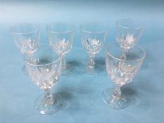 A set of six wine glasses, each etched with a bird