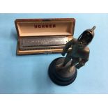 Hohner mouth organ and a table lighter