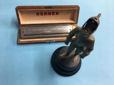 Hohner mouth organ and a table lighter