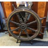 A large Ships wheel, 114cm wide