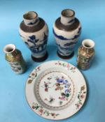 A small pair of Chinese Canton enamel vases, 15cm high, a Chinese plate and a pair of Chinese blue