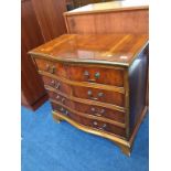 A yew wood serpentine chest of drawers