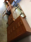 A teak dressing table and chest of drawers