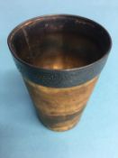 A horn beaker, with white metal liner and collar