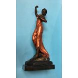 A cold cast painted bronze of a Lady holding a bunch of roses, on a stepped base, 54cm high