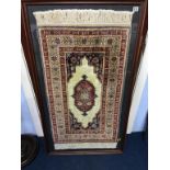 A framed and mounted Prayer mat