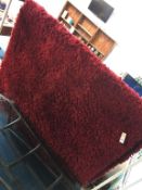 Two red wool rugs