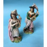 A pair of Staffordshire figures of a Man and Woman playing a Lute