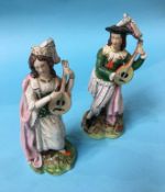 A pair of Staffordshire figures of a Man and Woman playing a Lute