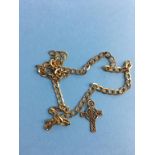 Yellow metal necklace and cross