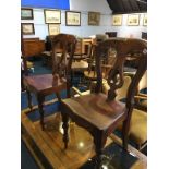 Two mahogany solid seat chairs