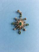 A yellow metal pendant, mounted with diamonds, emeralds and seed pearls, 3.8g, 35mm x 28mm approx.