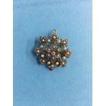 A '15ct' brooch mounted with central diamond and seed pearls, 5g, 28mm