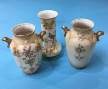 A garniture of three Crown Devon vases