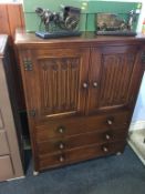 An oak linenfold cabinet