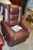 A burgundy leather rise and recliner