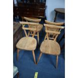A set of four Ercol Lucian Erolani chairs