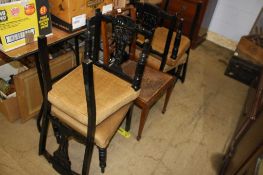 Four ebonised chairs and one other