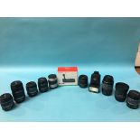 Nine various camera lenses, a flash and a canon gr