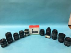 Nine various camera lenses, a flash and a canon gr