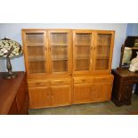 A pair of Ercol Golden Dawn glazed bookcases