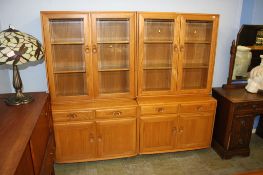 A pair of Ercol Golden Dawn glazed bookcases