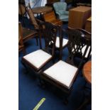 A set of four mahogany claw and ball dining chairs