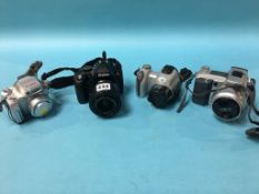 Four various digital cameras, including Pentax etc