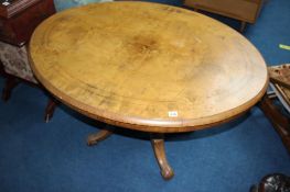 Victorian walnut oval tilt top dining table