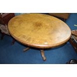 Victorian walnut oval tilt top dining table