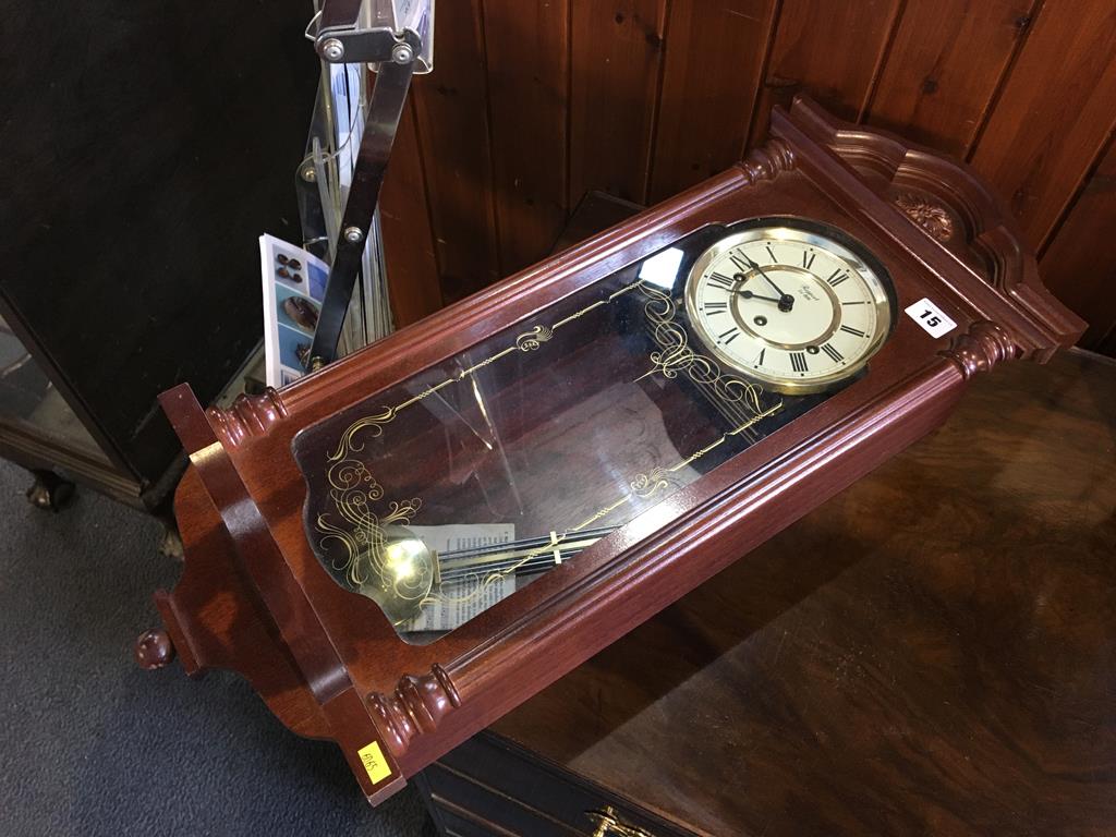 Mahogany wall clock and a rootman figural lamp