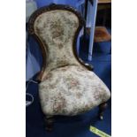 A Victorian walnut nursing chair