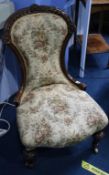 A Victorian walnut nursing chair