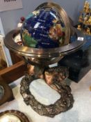 A Globe on decorative stand