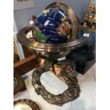 A Globe on decorative stand