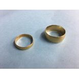An 18ct gold ring, 8.2g and a 22ct gold ring, 2.9g