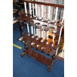 An Edwardian mahogany riding boot stand