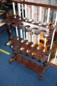 An Edwardian mahogany riding boot stand