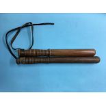 Two turned truncheons