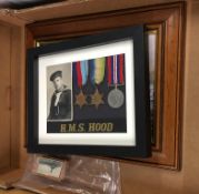 Framed H.M.S. Hood pictures and medals, etc.