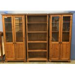 Two pine display cabinets and matching pine bookcase